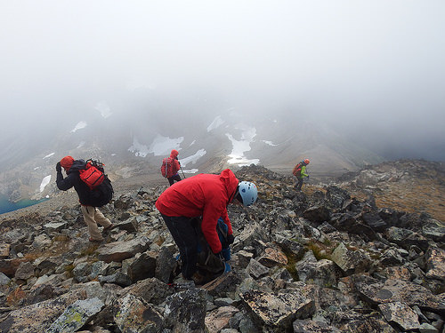 Group of mountaineers preparing for descend