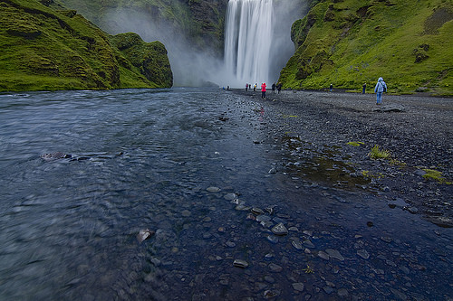Hundreds of people come to admire Skogafoss, no matter what the weather.
